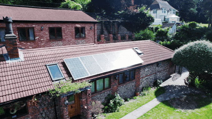 Photo of a house with solar panels on the roof
