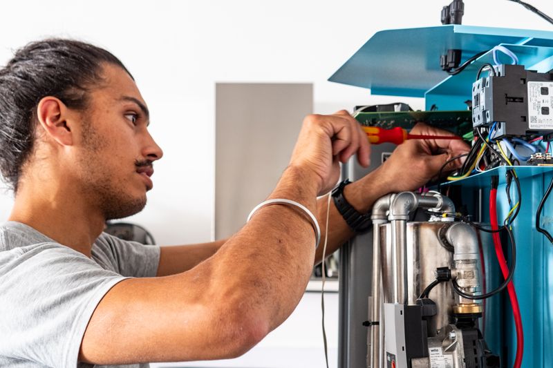 Photo of someone working on a Bolt e-boiler